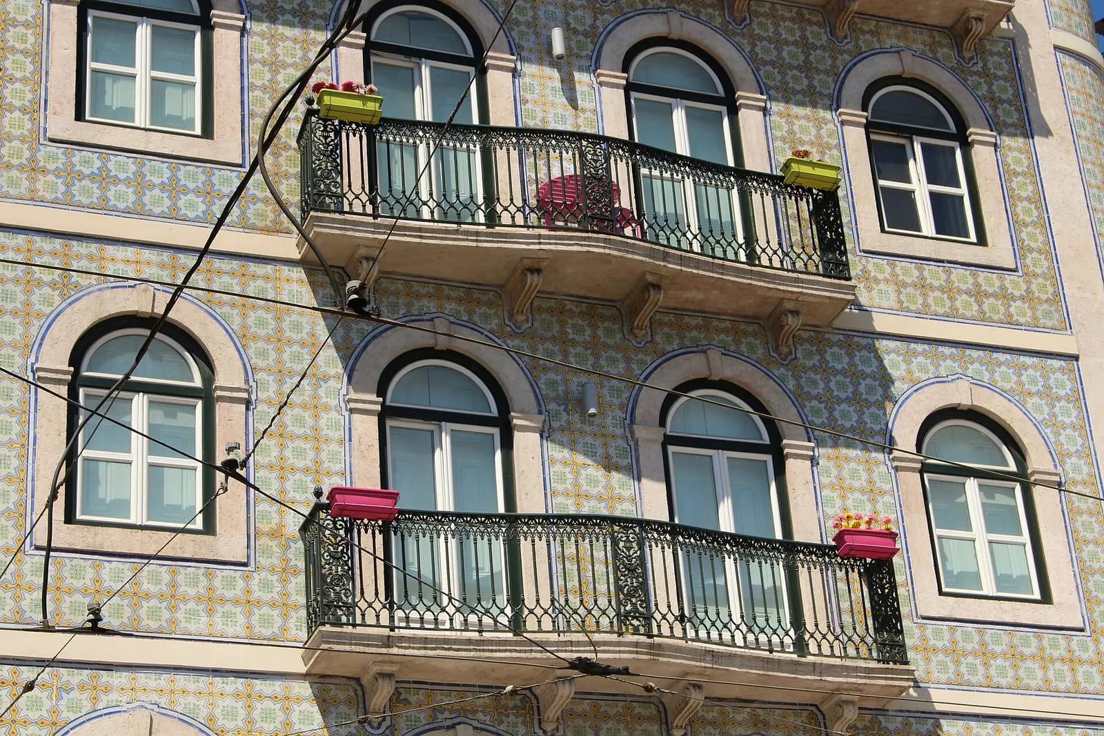 Traditional azulejo tilework on a building facade in Lisbon, Portugal.