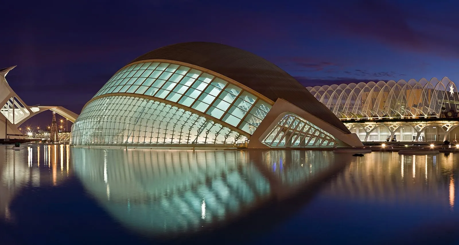 The white curved buildings of the City of Arts and Sciences reflected in a pool in Valencia, Spain