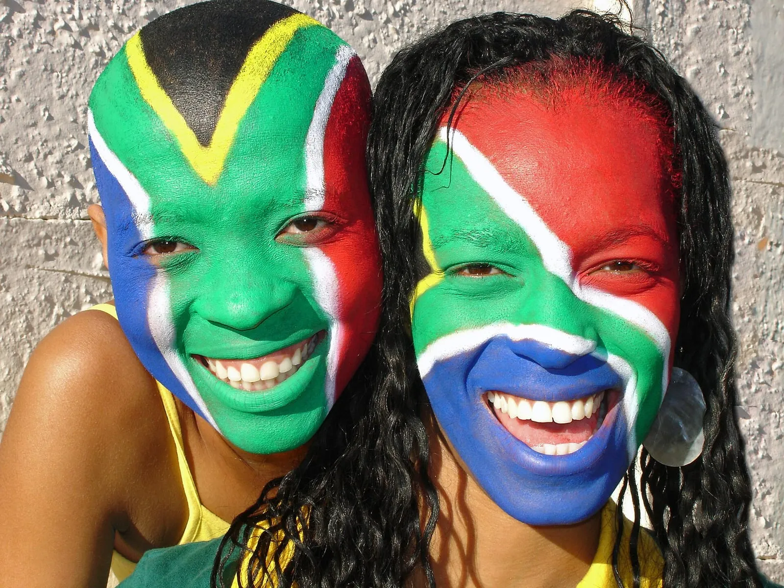World Cup football fans in team colours filling stadium stands